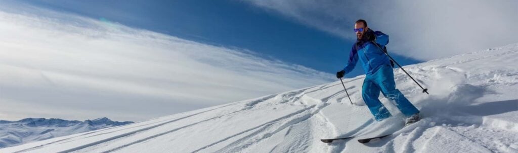 An expert skier on a ski trip